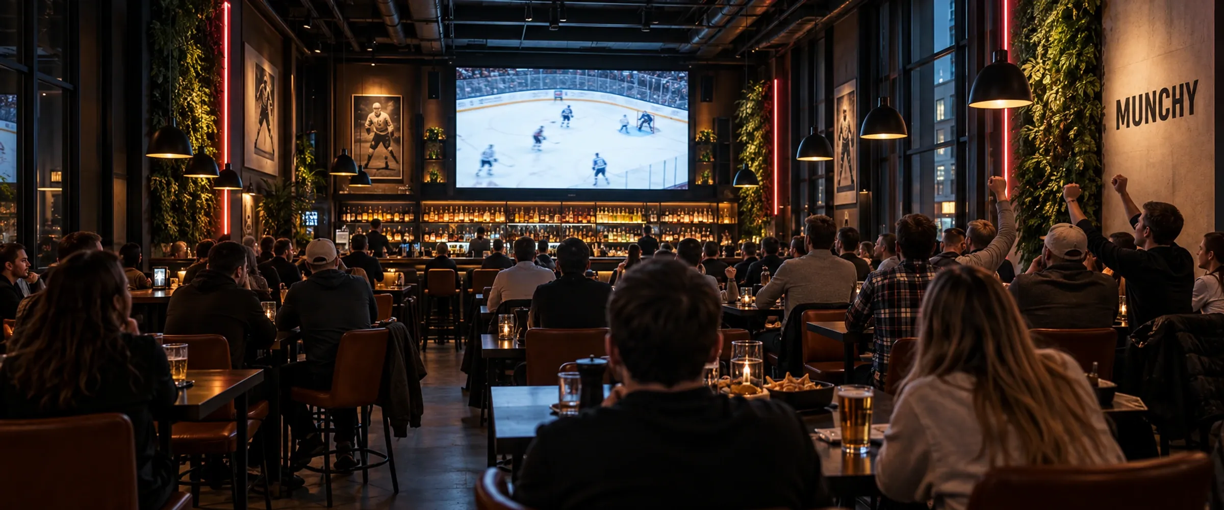 Volle Sportsbar beim NHL-Spiel auf dem gro&szlig;en Screen
